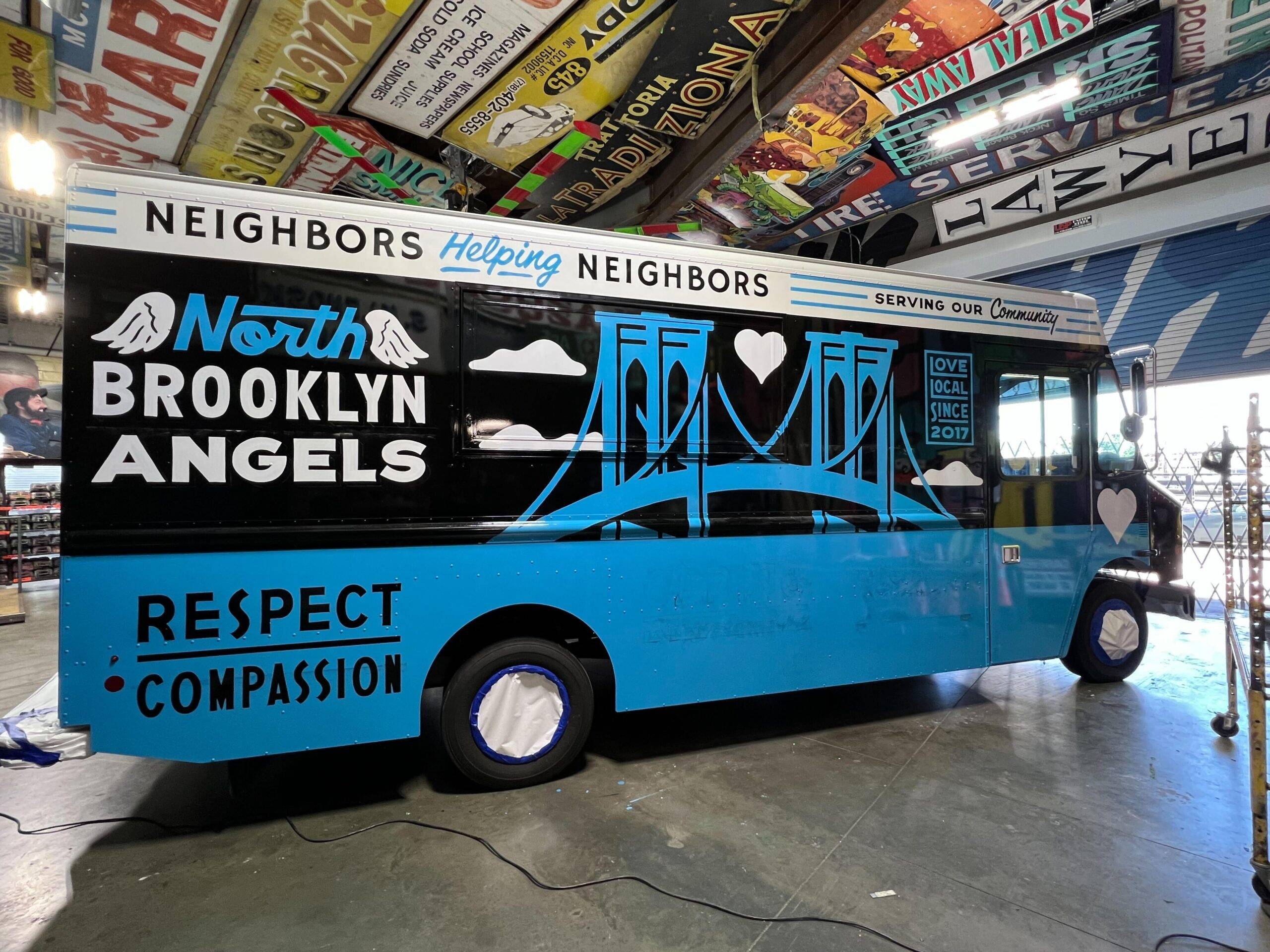 North Brooklyn Angels truck parked in garage.